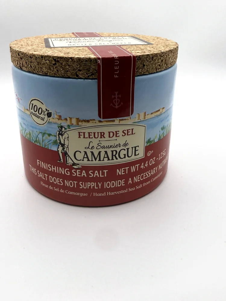 Cardboard drum of Le Saunier de Camargue fleur de sel with a cork lid and a painted scene of the Aigues-Mortes ramparts