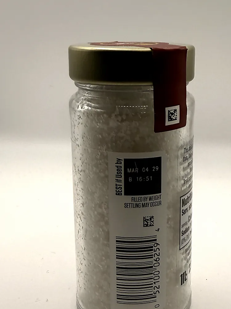 Barcode and best-if-used-by code on the McCormick Gourmet Fleur de Sel jar