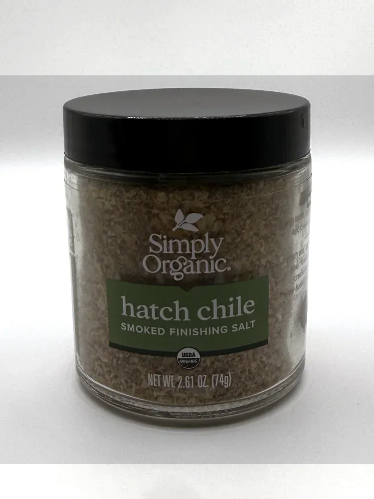 Small glass jar of Simply Organic Hatch Chile Smoked Finishing Salt with a black lid and green label