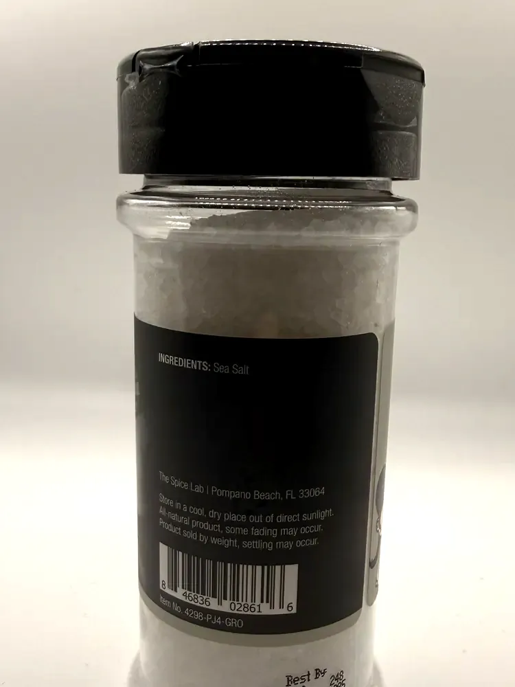 Ingredient, company address, storage directions, barcode and lot code on The Spice Lab salt jar