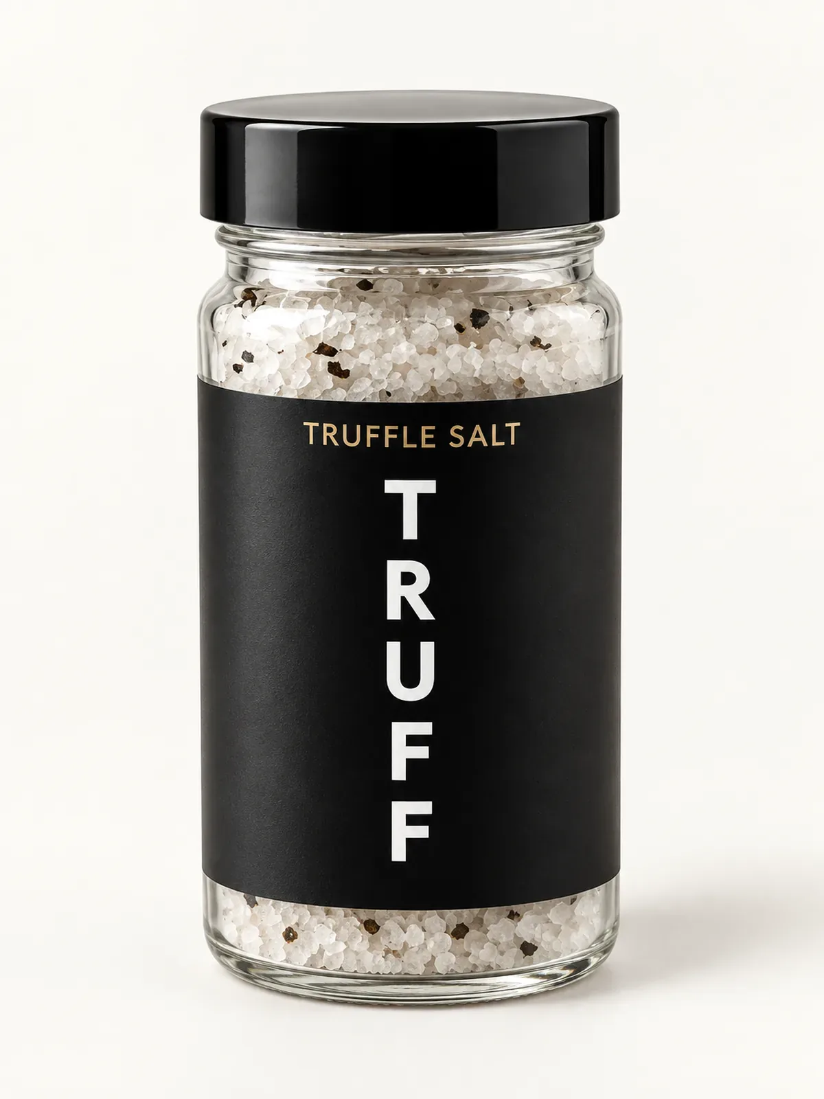 Glass jar of TRUFF Black Truffle Salt with a black label and black lid